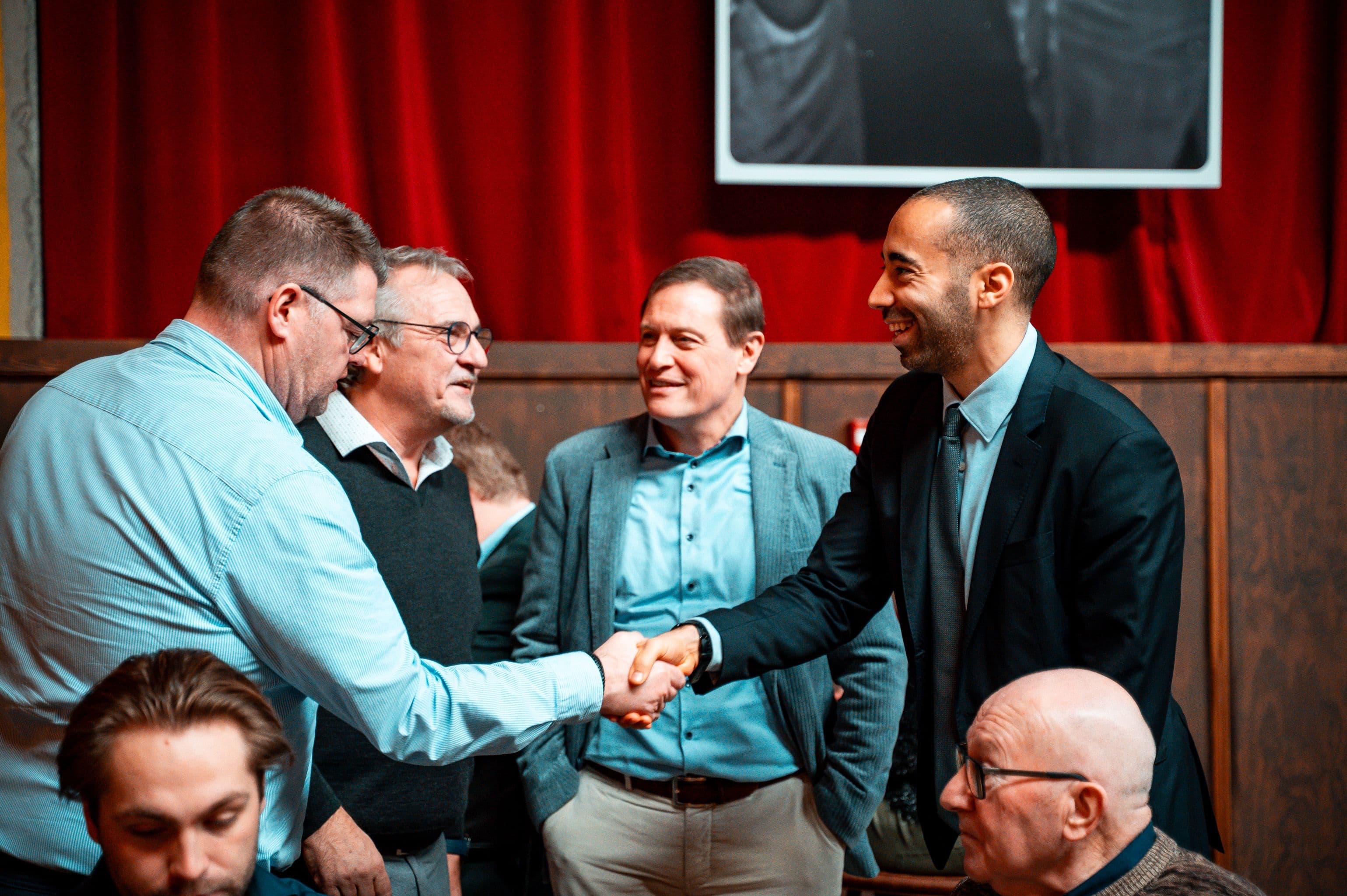 Professional handshake representing customer enquiries and quotation support